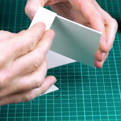 Four bottles of PVA and Hi-Tack glue on a cutting mat