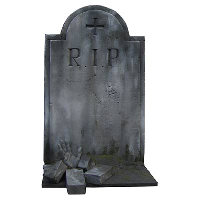 A finished grey tombstone carved with RIP, standing on a mound with moss