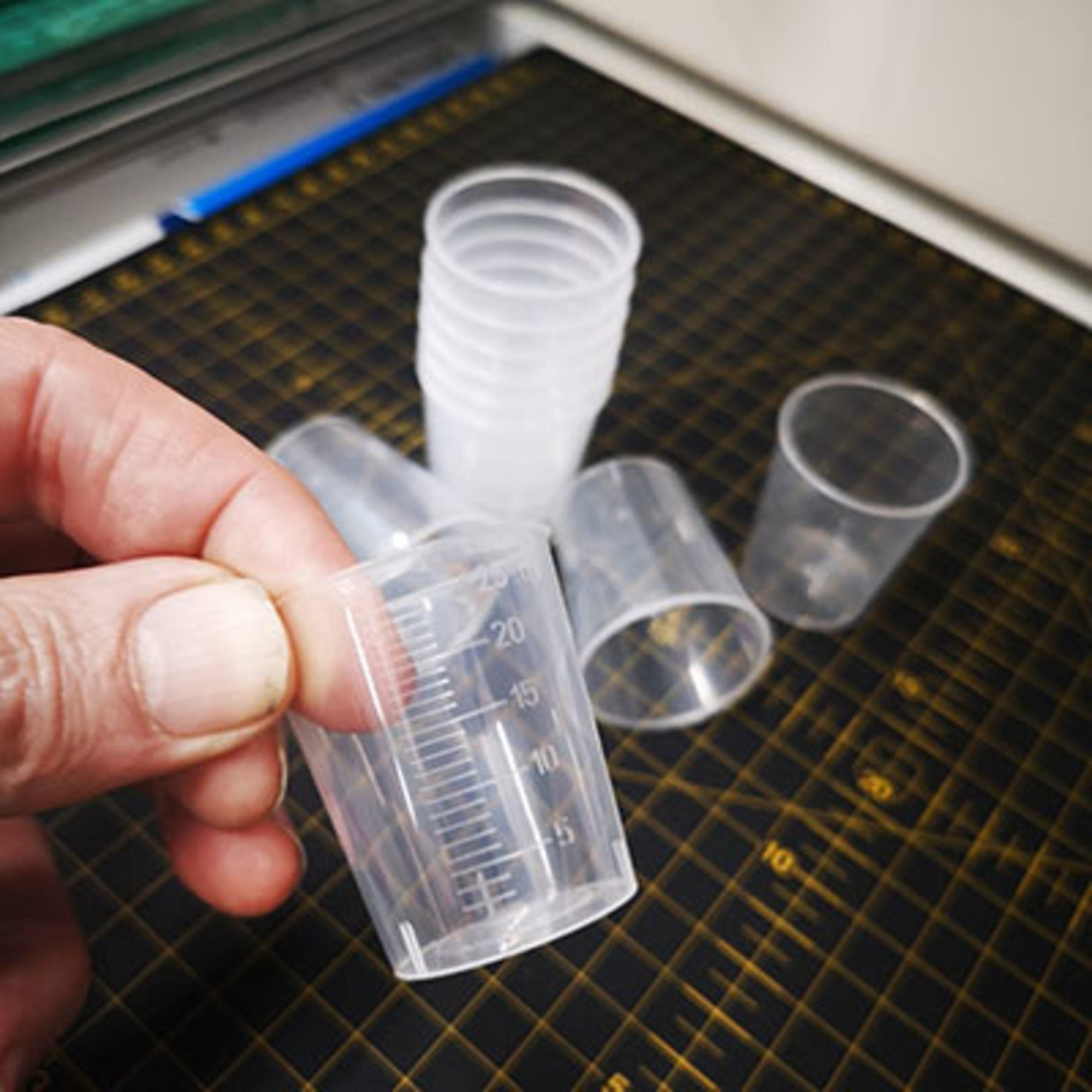 Measuring cup 25ml (10 pcs)